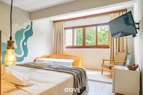 Pousada Recanto Nalu - Quarto à Vistaにあるベッド
