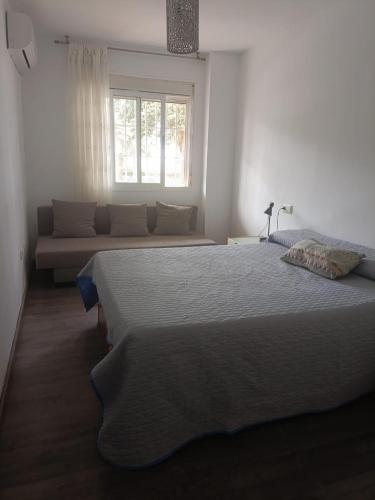 Postel nebo postele na pokoji v ubytování Primera linea playa