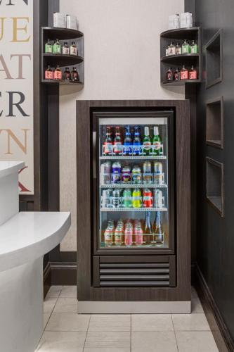 a refrigerator filled with lots of drinks in a store at Courtyard New York Manhattan/Midtown East in New York