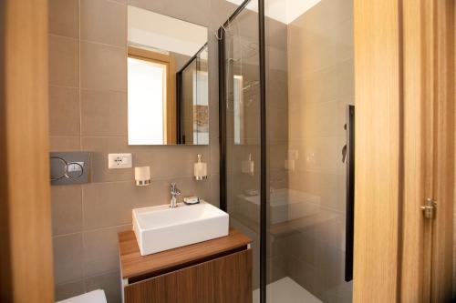 a bathroom with a sink and a shower at Relais Rosselli in Rome