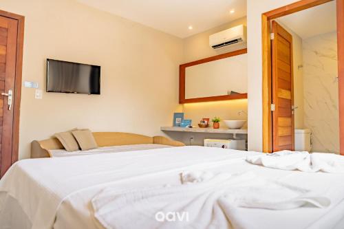 Pousada Recanto Nalu - Quarto à Vistaにあるベッド