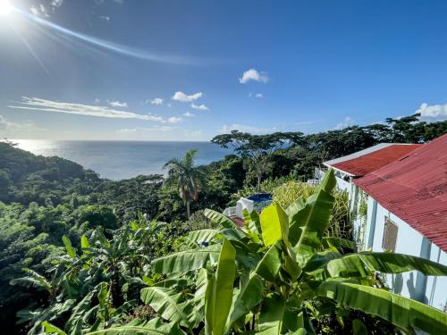 a view of the ocean from a house at Mount Edgecombe Boutique Hotel in Maran