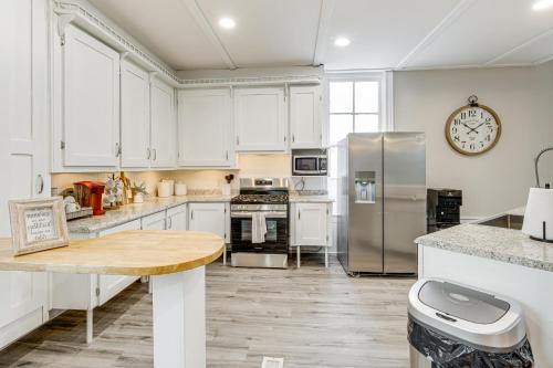 a kitchen with white cabinets and stainless steel appliances at Unique Church Turned Family Retreat Relax and Enjoy in Alliance