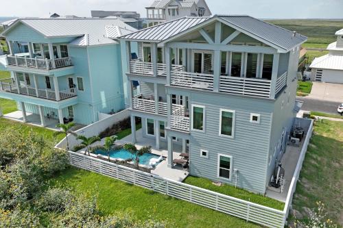 an aerial view of a blue house at BeachHouse Bliss in Padre Island