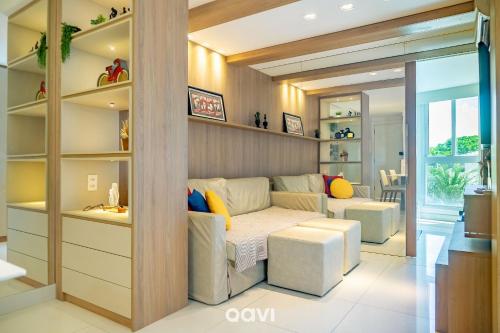 a living room with a couch and a table at Duplex no In Mare Bali by Qavi in Granja Beira Mar