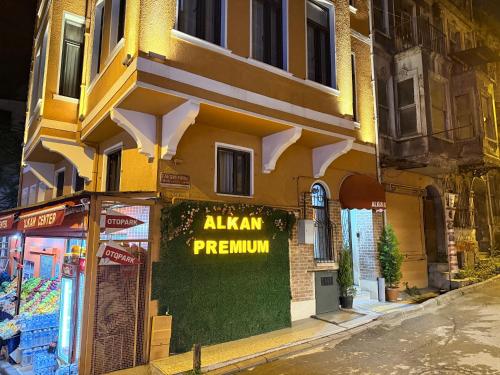 a building with a pharmacy sign on the side of it at Taksim alkan tower residence in Istanbul
