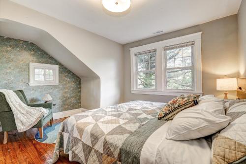 a bedroom with a bed and a chair and a window at Hilltop retreat - Large pool in Woodlawn