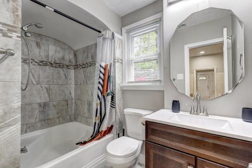 a bathroom with a sink and a toilet and a shower at Hilltop retreat - Large pool in Woodlawn