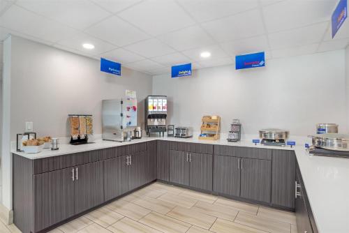 a large room with a counter and a kitchen at Best Western Brewton Inn in Brewton