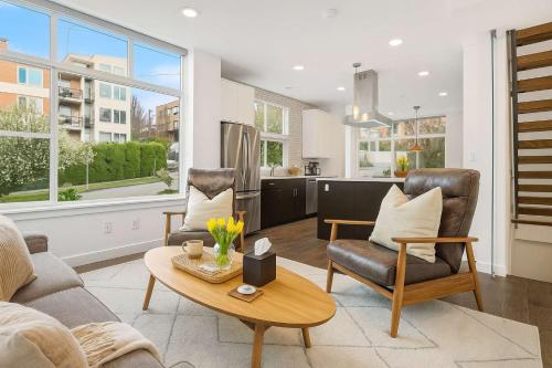a living room with two chairs and a table at Near Space Needle Climate Pledge Roof Deck in Seattle