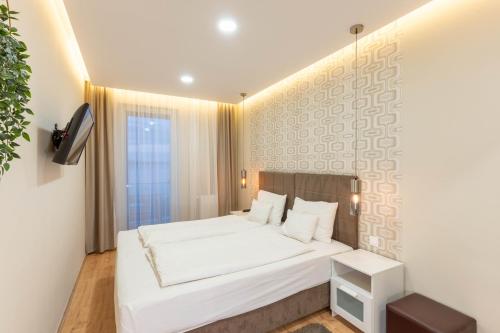 Postel nebo postele na pokoji v ubytování Lakeside Panorama Apartment 115