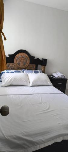 Ένα ή περισσότερα κρεβάτια σε δωμάτιο στο Apartamento Privado Edificio EntreLagos
