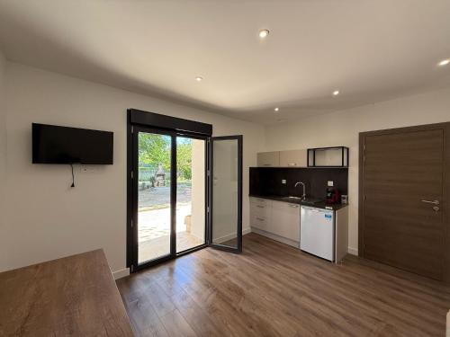 a kitchen with a sink and a counter top at Montelimar Location in Montélimar