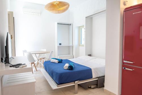 Ένα ή περισσότερα κρεβάτια σε δωμάτιο στο Torre Bastione di Capo Marchiafava