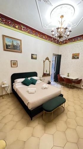 a bedroom with a large bed and a table at Pantheon Luxury Noble Apartment in Rome