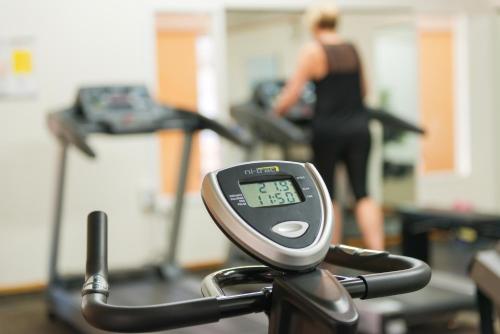 a close up of a scale with a woman in a gym at Distinction Whangarei Hotel & Conference Centre in Whangarei