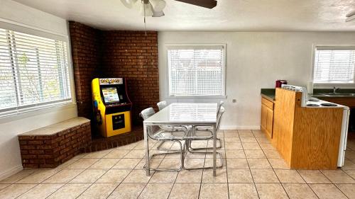 a dining room with a table and a video game at Hurricane Homestead Rentals in Hurricane
