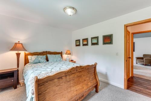 a bedroom with a wooden bed in a room at Palmer Escape with Mtn Views Fishing and Hiking! in Palmer