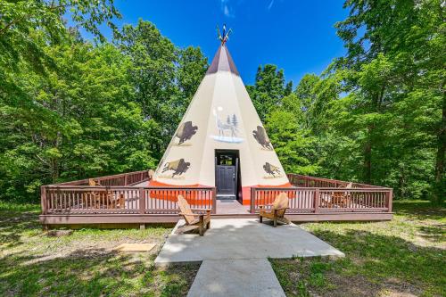 a pyramid house with two chairs in front of it at 5 Mi to Mammoth Cave NP Teepee Studio Escape in Cub Run