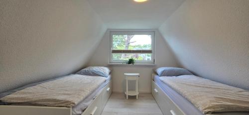 Кровать или кровати в номере Finnenhütte "MH77"