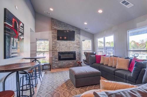a living room with a couch and a fireplace at Home Away From Home in Marietta