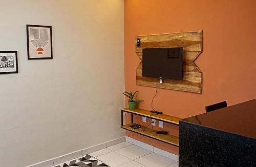 Een TV en/of entertainmentcenter bij Loft Lampião
