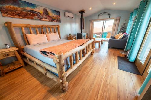 a bedroom with a wooden bed in a room at Charming Turquoise Cabin in Monument Valley in Monument Valley