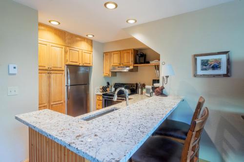 a kitchen with a sink and a counter top at Cimarron Lodge 35 condo in Telluride