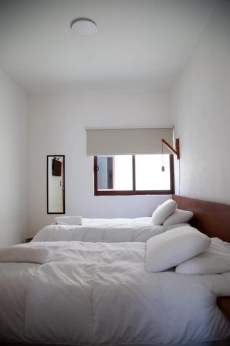 Katil atau katil-katil dalam bilik di Comala Bed & Breakfast
