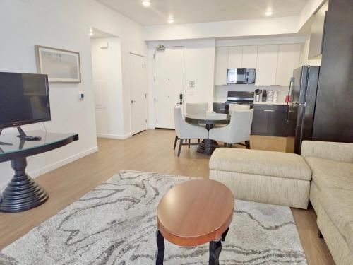 a living room with a couch and a table at Stylish Urban Escape in Downtown Los Angeles in Los Angeles