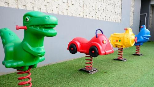 a group of plastic toys on display in a room at Gapyeong Eco Healing Pool Villa Pension in Gapyeong