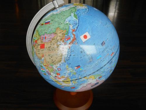 a globe of the world on a wooden stand at kinugawaonsen Fukumatsu in Nikko