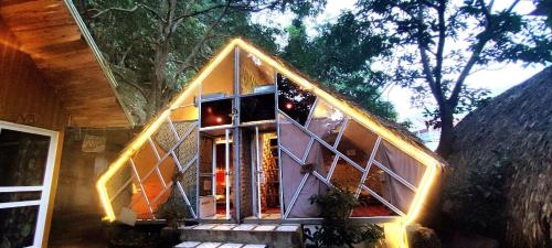 a house with a large window in the middle at Homestay Gấu Smile - Mộc Châu in Sơn La