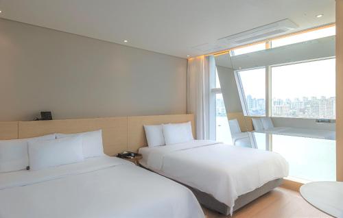 Una cama o camas en una habitación de Hotel Marine view