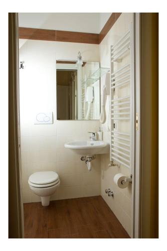 a bathroom with a toilet and a sink at Lepetit Milano in Milan