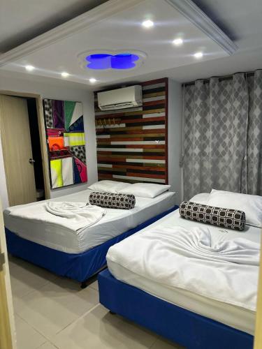Postel nebo postele na pokoji v ubytování tocore suites beach