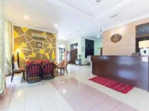 a living room with a couch and a table at INB Resort Ayer Keroh in Kampong Ladang Baharu