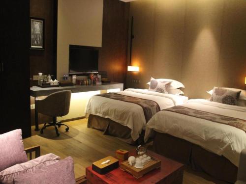Letto o letti in una camera di Southeast Peninsula Hotel Quanzhou