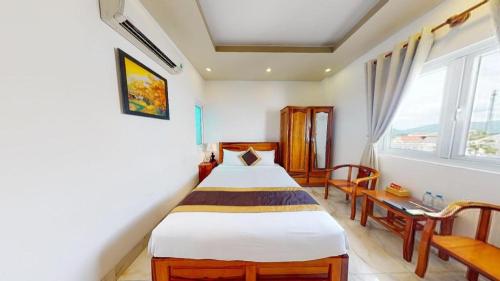 Giường trong phòng chung tại Hong Mai Hotel Nha Trang