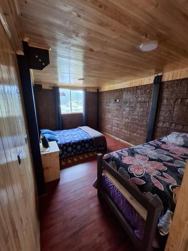 Postel nebo postele na pokoji v ubytování Departamentos Espacio Rio Chovellen