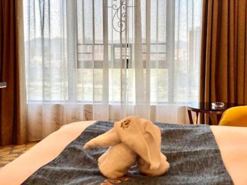 Postel nebo postele na pokoji v ubytování Enping Yucca Hotel