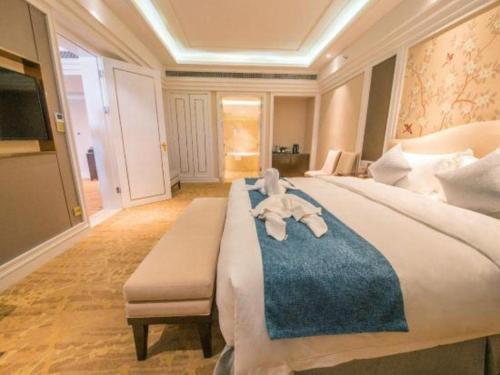 Postel nebo postele na pokoji v ubytování Enping Yucca Hotel