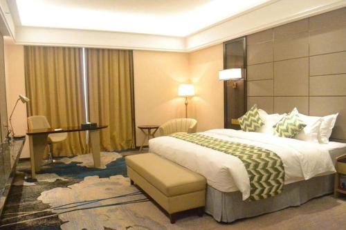 Postel nebo postele na pokoji v ubytování Enping Yucca Hotel