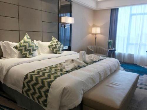 Postel nebo postele na pokoji v ubytování Enping Yucca Hotel