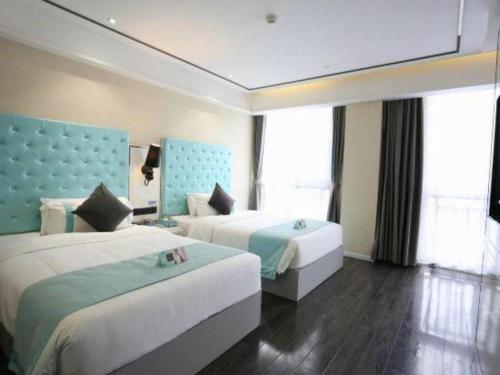 Ένα ή περισσότερα κρεβάτια σε δωμάτιο στο Xana Lite Neijiang Zizhong Shanghehui Branch