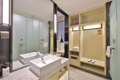 Ένα μπάνιο στο Echarm Hotel Changchun Yiqi Automotive Trade City Wanda