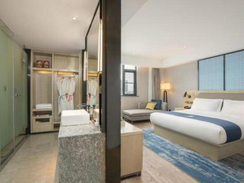 Ένα ή περισσότερα κρεβάτια σε δωμάτιο στο Echarm Hotel Jianshui Gucheng