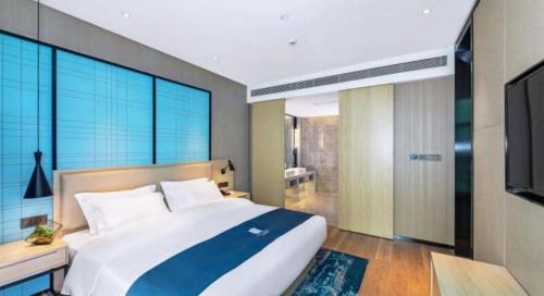 Letto o letti in una camera di Echarm Hotel Guilin Zhongshan Zhong Road Liangjiang Sihu