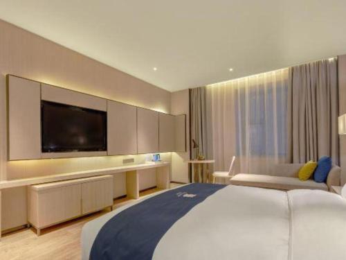 Katil atau katil-katil dalam bilik di Echarm Hotel Liuzhou High-speed Railway Station