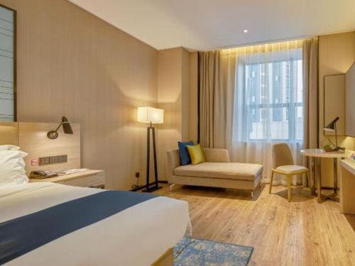 Katil atau katil-katil dalam bilik di Echarm Hotel Liuzhou High-speed Railway Station
